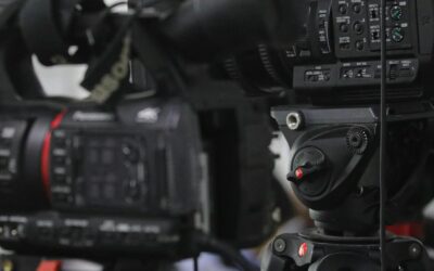 Close-up of professional video cameras set for filming indoors.